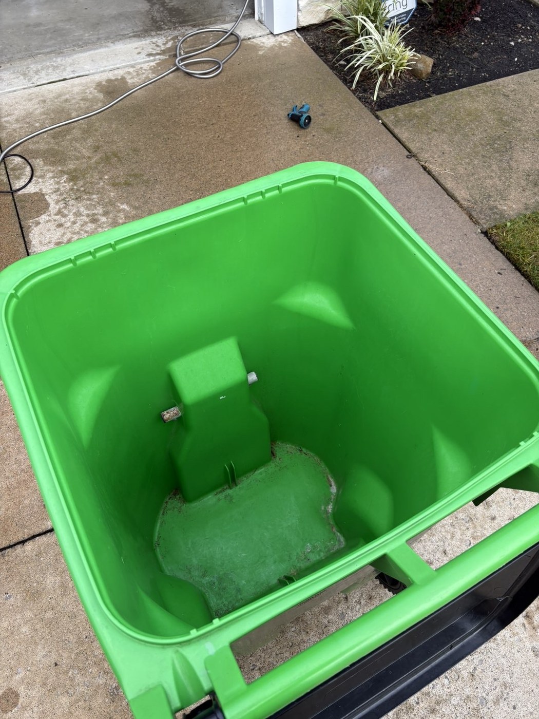 Green trash bin after interior cleaning
